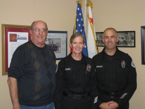 Police Chief Dan Watson with new Reserve Officers Ingrid and Mike Braun