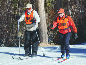 Wounded Warrior Carlos Franco blazes a trail, accompanied by DSES Volunteer Dorie Bourelle. Photos by