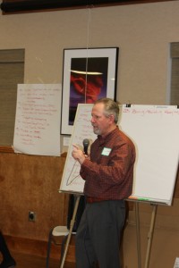Bishop City Administrator and workshop leader Jim Tatum in front of the long list of concerns and issues facing the local business community.