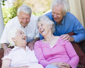 four older people laughing