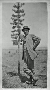 Fred Easton standing next to the Roosevelt Tree in 1913