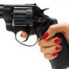 gun held in woman's hand