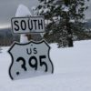395 hwy sign buried in snow